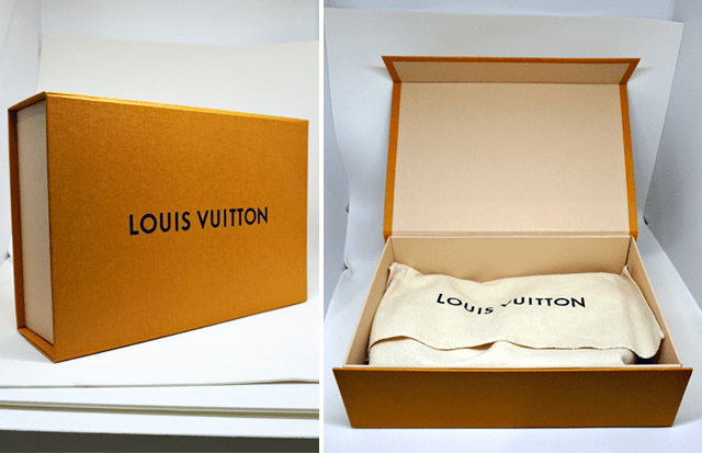 Caixa com dust bag da Louis Vuitton.